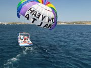 2 people doing parasailing